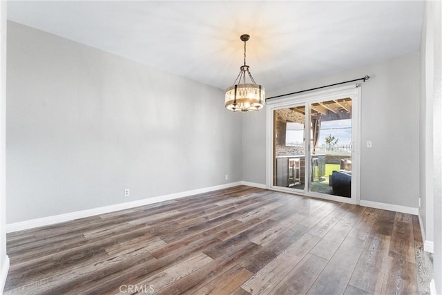 21751 Lanar, Mission Viejo, CA 92692 - unfurnished room featuring a chandelier and wood finished floors