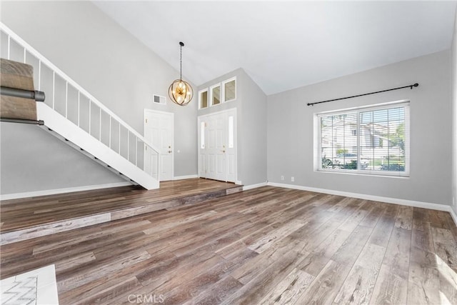 21751 Lanar, Mission Viejo, CA 92692 - entrance foyer featuring stairs, wood finished floors, high vaulted ceiling, and a chandelier