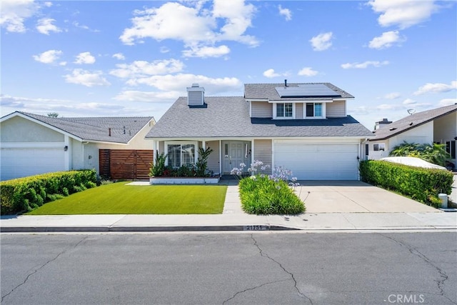 21751 Lanar, Mission Viejo, CA 92692 - traditional-style home with driveway, roof mounted solar panels, a chimney, and a garage