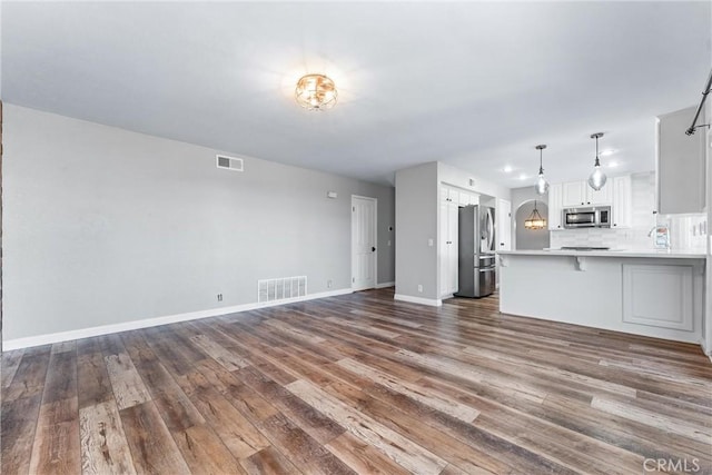 21751 Lanar, Mission Viejo, CA 92692 - unfurnished living room with dark wood-style floors and baseboards