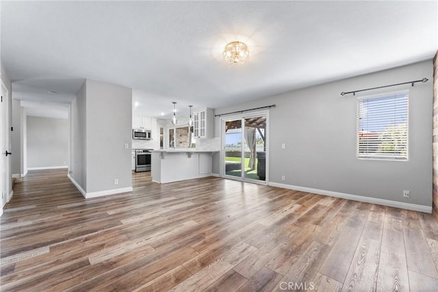 21751 Lanar, Mission Viejo, CA 92692 - unfurnished living room featuring light wood-style floors and baseboards