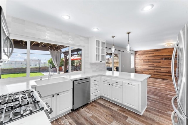 21751 Lanar, Mission Viejo, CA 92692 - kitchen with appliances with stainless steel finishes, a peninsula, healthy amount of natural light, white cabinets, and recessed lighting