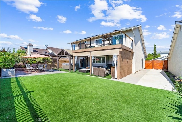 21751 Lanar, Mission Viejo, CA 92692 - rear view of property featuring a hot tub, a patio area, a gate, outdoor lounge area, and stucco siding