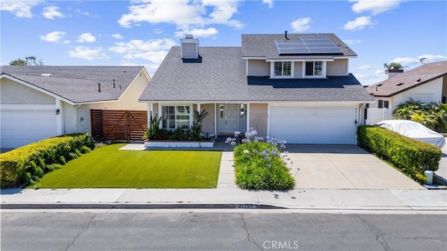 21751 Lanar, Mission Viejo, CA 92692 - traditional-style house with concrete driveway, roof mounted solar panels, a chimney, roof with shingles, and a garage