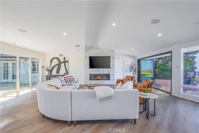 14757 Rockhill Dr, Hacienda Heights, CA 91745 - living area with a fireplace, lofted ceiling, wood finished floors, and recessed lighting