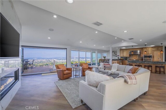 14757 Rockhill Dr, Hacienda Heights, CA 91745 - living area featuring wood finished floors and recessed lighting