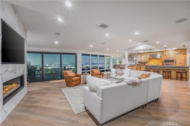 14757 Rockhill Dr, Hacienda Heights, CA 91745 - living area featuring a premium fireplace, light wood-style floors, and recessed lighting