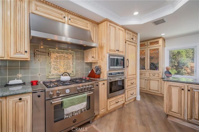 14757 Rockhill Dr, Hacienda Heights, CA 91745 - kitchen with appliances with stainless steel finishes, under cabinet range hood, light wood-type flooring, tasteful backsplash, and recessed lighting