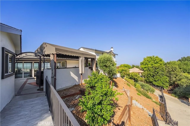 14757 Rockhill Dr, Hacienda Heights, CA 91745 - view of side of home with a garden and stucco siding