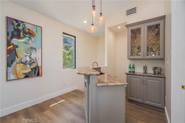14757 Rockhill Dr, Hacienda Heights, CA 91745 - indoor wet bar featuring dark wood finished floors, hanging light fixtures, and recessed lighting