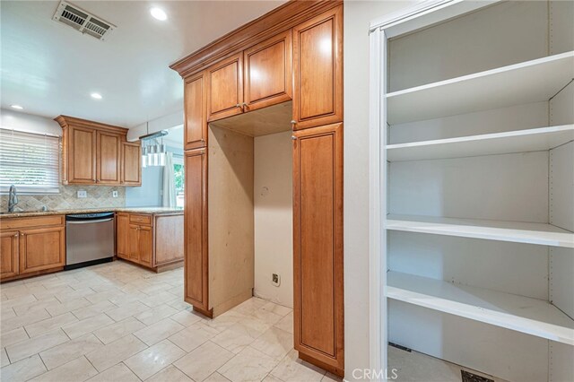 20129 Halsted St, Chatsworth, CA 91311 - kitchen with dishwasher, brown cabinetry, light countertops, decorative backsplash, and recessed lighting