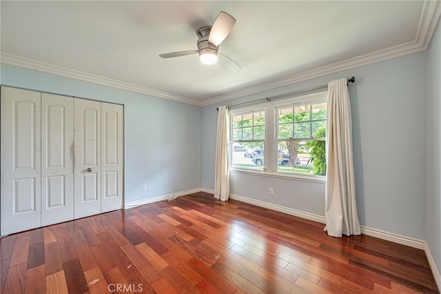 20129 Halsted St, Chatsworth, CA 91311 - unfurnished bedroom featuring dark wood-style flooring, crown molding, a ceiling fan, and a closet
