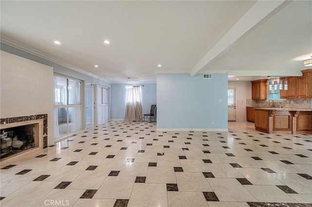 20129 Halsted St, Chatsworth, CA 91311 - unfurnished living room featuring recessed lighting, a fireplace, light tile patterned floors, ornamental molding, and healthy amount of natural light