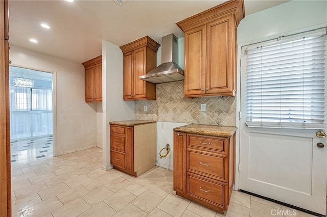 20129 Halsted St, Chatsworth, CA 91311 - kitchen with wall chimney exhaust hood, brown cabinets, tasteful backsplash, recessed lighting, and light stone countertops