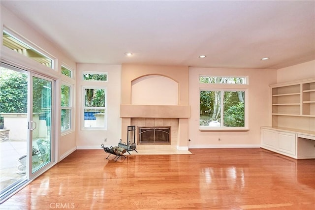 26821 Moore Oaks Rd, Laguna Hills, CA 92653 - unfurnished living room featuring a fireplace, wood finished floors, and recessed lighting