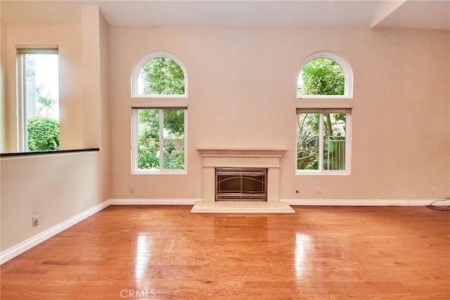26821 Moore Oaks Rd, Laguna Hills, CA 92653 - unfurnished living room featuring wood finished floors and a fireplace with raised hearth