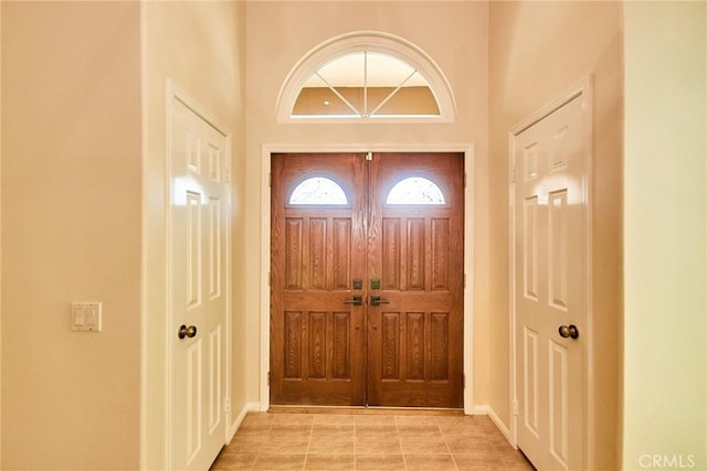 26821 Moore Oaks Rd, Laguna Hills, CA 92653 - entrance foyer featuring a high ceiling and light tile patterned floors