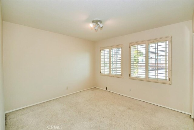 26821 Moore Oaks Rd, Laguna Hills, CA 92653 - carpeted empty room featuring baseboards