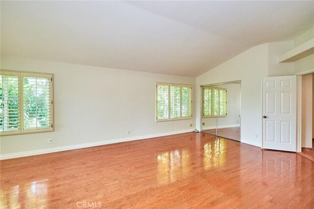 26821 Moore Oaks Rd, Laguna Hills, CA 92653 - empty room featuring wood finished floors and vaulted ceiling