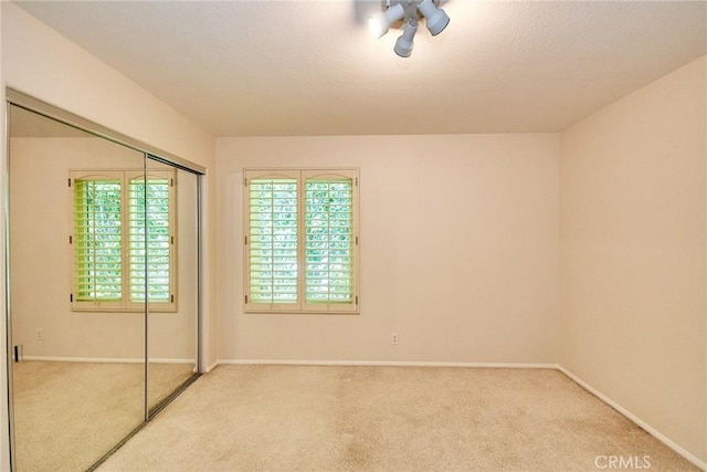 26821 Moore Oaks Rd, Laguna Hills, CA 92653 - unfurnished bedroom featuring light colored carpet and a closet