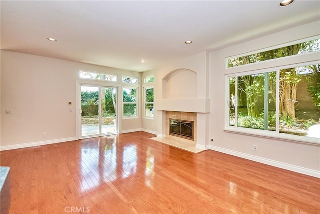 26821 Moore Oaks Rd, Laguna Hills, CA 92653 - unfurnished living room with a fireplace, light wood finished floors, and recessed lighting