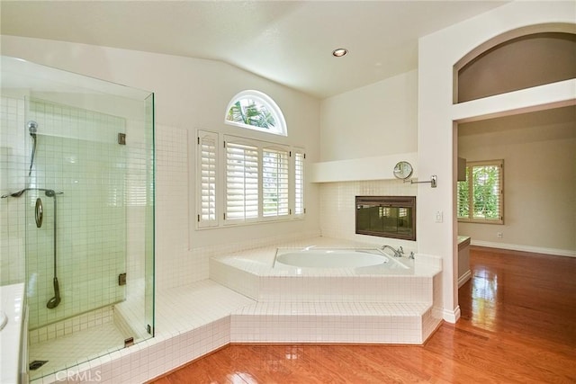 26821 Moore Oaks Rd, Laguna Hills, CA 92653 - full bathroom featuring healthy amount of natural light, a garden tub, wood finished floors, a shower stall, and lofted ceiling