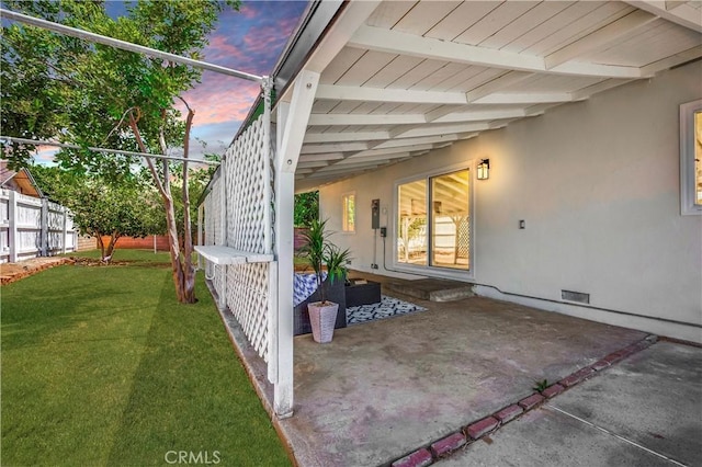10028 Judy Ct, Riverside, CA 92503 - patio terrace at dusk featuring a patio area and an attached carport