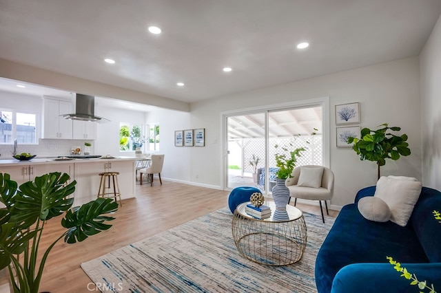 10028 Judy Ct, Riverside, CA 92503 - living room with light wood-type flooring, healthy amount of natural light, and recessed lighting