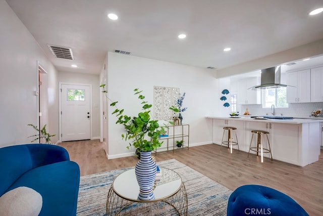10028 Judy Ct, Riverside, CA 92503 - living area with light wood-style flooring and recessed lighting