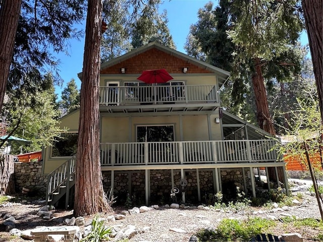 41379 Rainbow Ln, Forest Falls, CA 92339 - rear view of property with a balcony, stairway, and stucco siding