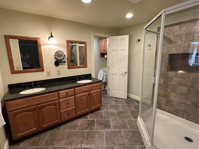 41379 Rainbow Ln, Forest Falls, CA 92339 - bathroom featuring double vanity, a stall shower, and recessed lighting