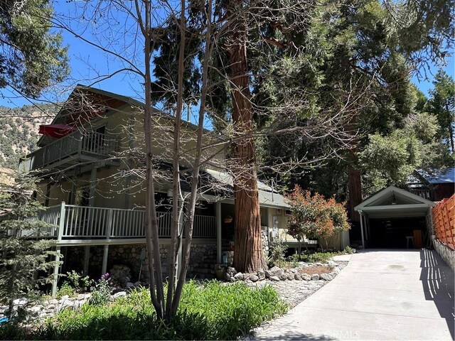 41379 Rainbow Ln, Forest Falls, CA 92339 - view of property exterior featuring a balcony and stone siding