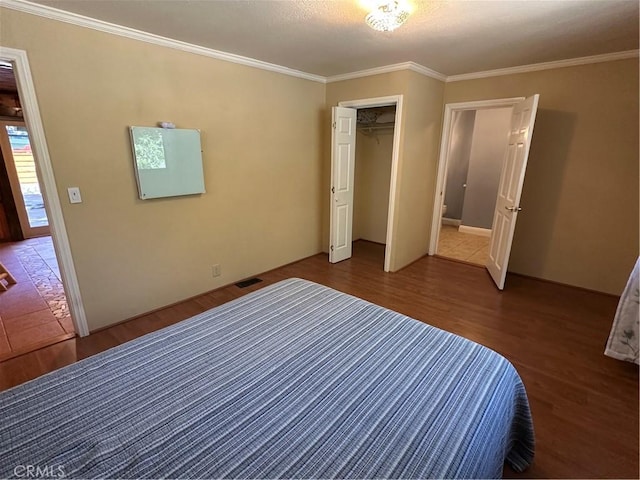 41379 Rainbow Ln, Forest Falls, CA 92339 - unfurnished bedroom with wood finished floors, ornamental molding, and a closet