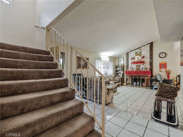 7800 Winnetka Ave, Winnetka, CA 91306 - stairway with a textured ceiling, lofted ceiling, and tile patterned floors