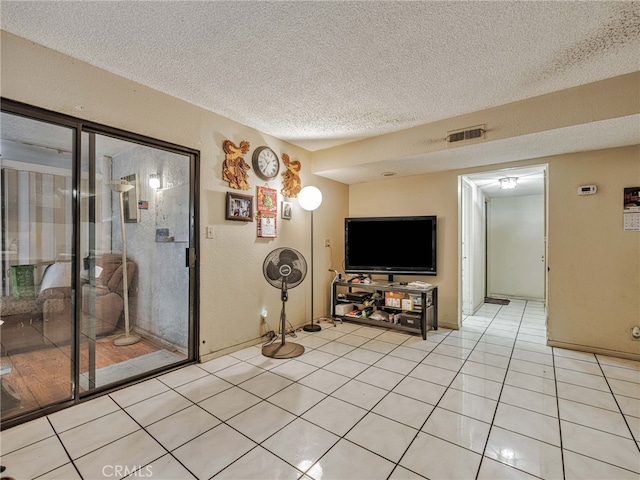 7800 Winnetka Ave, Winnetka, CA 91306 - living room featuring a textured ceiling and light tile patterned flooring