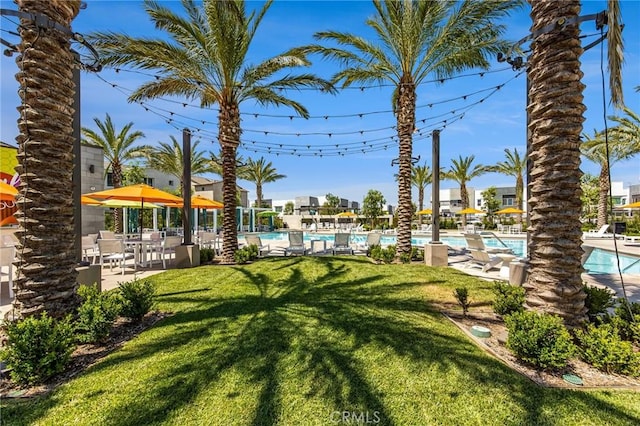 3540 E Peckham Paseo Unit 5, Ontario, CA 91761 - view of green lawn with a community pool and a patio