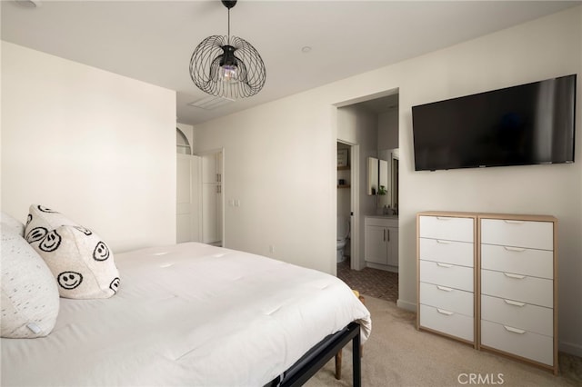 3540 E Peckham Paseo Unit 5, Ontario, CA 91761 - bedroom featuring light colored carpet and connected bathroom
