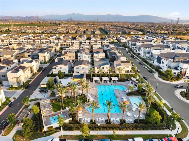 3540 E Peckham Paseo Unit 5, Ontario, CA 91761 - aerial perspective of suburban area with a mountain backdrop and a pool area