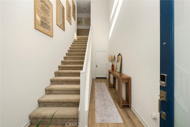 3540 E Peckham Paseo Unit 5, Ontario, CA 91761 - stairs featuring wood finished floors and baseboards