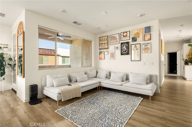 3540 E Peckham Paseo Unit 5, Ontario, CA 91761 - living room featuring wood finished floors and ceiling fan