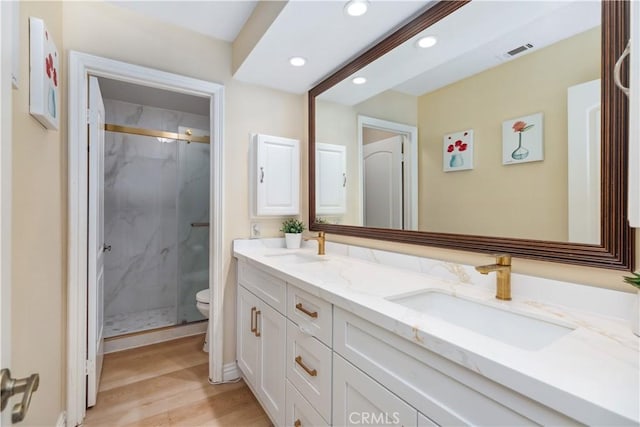 21620 Brisbane Way, Yorba Linda, CA 92887 - bathroom featuring double vanity, recessed lighting, a marble finish shower, and wood finished floors