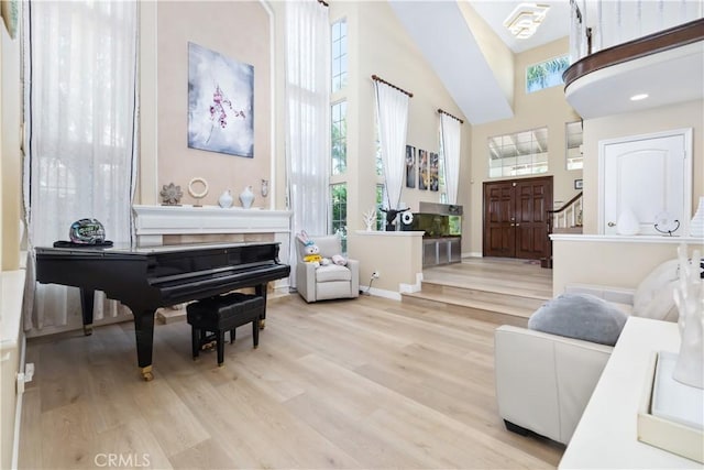 21620 Brisbane Way, Yorba Linda, CA 92887 - sitting room with healthy amount of natural light, a towering ceiling, and light wood-style flooring