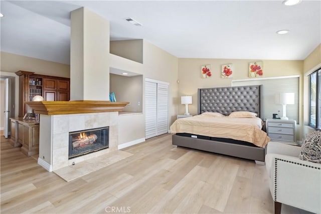 21620 Brisbane Way, Yorba Linda, CA 92887 - bedroom with light wood-style flooring, a fireplace, recessed lighting, and lofted ceiling