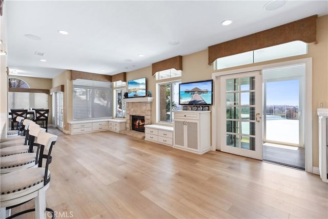 21620 Brisbane Way, Yorba Linda, CA 92887 - unfurnished living room with light wood-type flooring, a stone fireplace, and recessed lighting