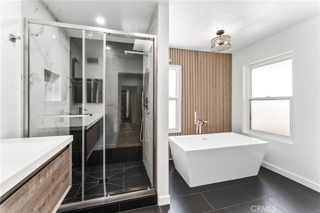 5401 Zelzah Ave Unit 114, Encino, CA 91316 - full bath featuring vanity, a marble finish shower, a freestanding bath, and tile patterned floors