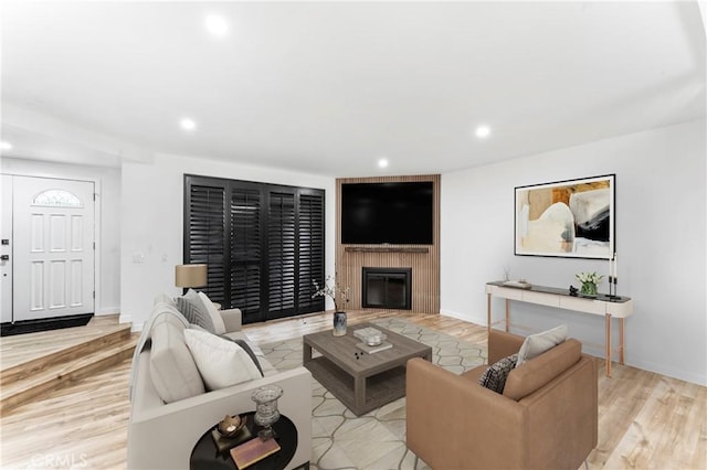 5401 Zelzah Ave Unit 114, Encino, CA 91316 - living area with recessed lighting, light wood-type flooring, and a fireplace