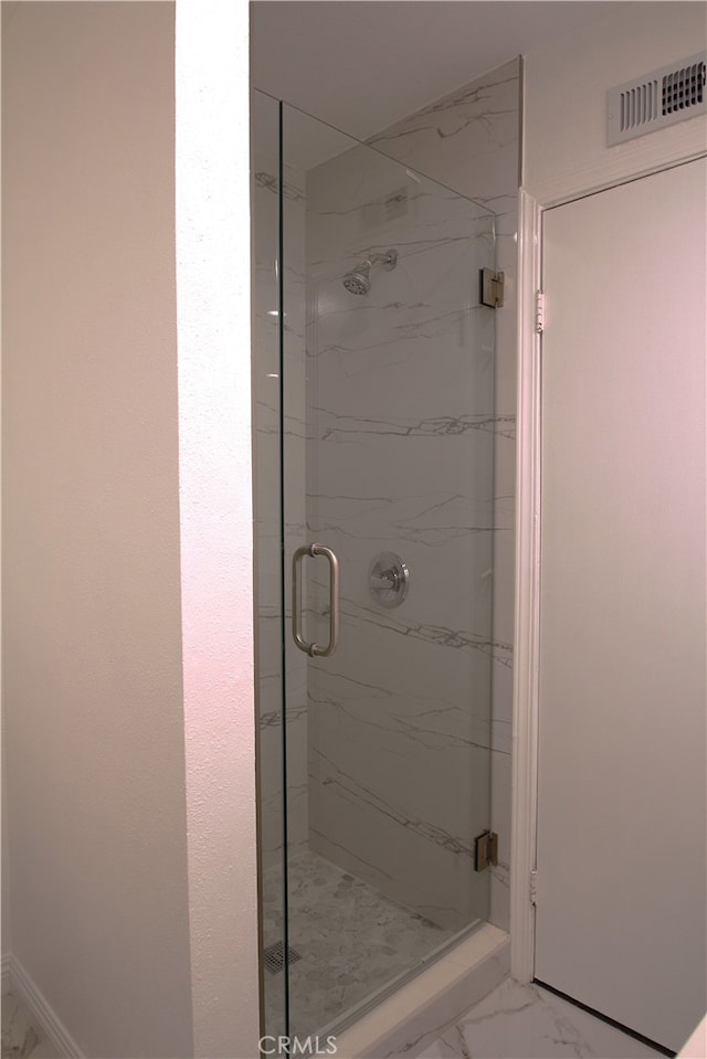 764 E Turmont St, Carson, CA 90746 - bathroom with a marble finish shower and marble look tiles