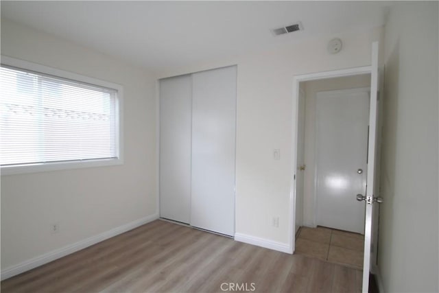 764 E Turmont St, Carson, CA 90746 - unfurnished bedroom with light wood-type flooring and a closet
