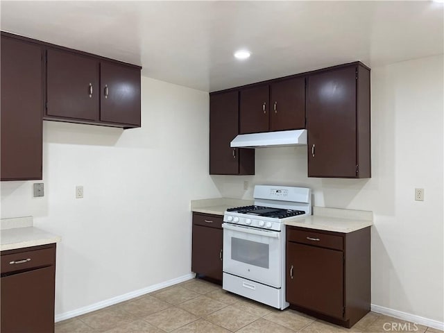 764 E Turmont St, Carson, CA 90746 - kitchen with white range with gas stovetop, under cabinet range hood, and light countertops