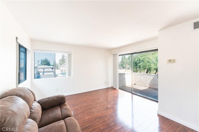 1317 Massachusetts Ave Unit 202, Riverside, CA 92507 - living room with dark wood-style floors and baseboards